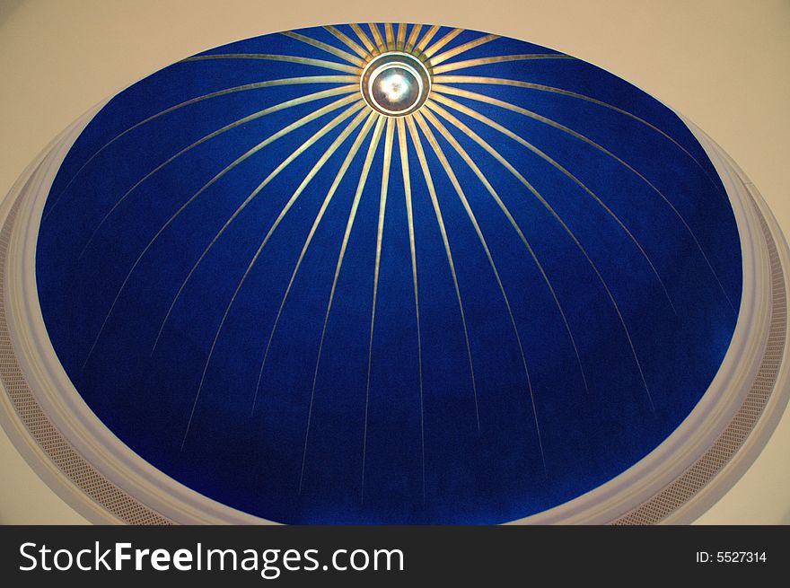 Close up on a blue glass cupola over white ceiling. Close up on a blue glass cupola over white ceiling