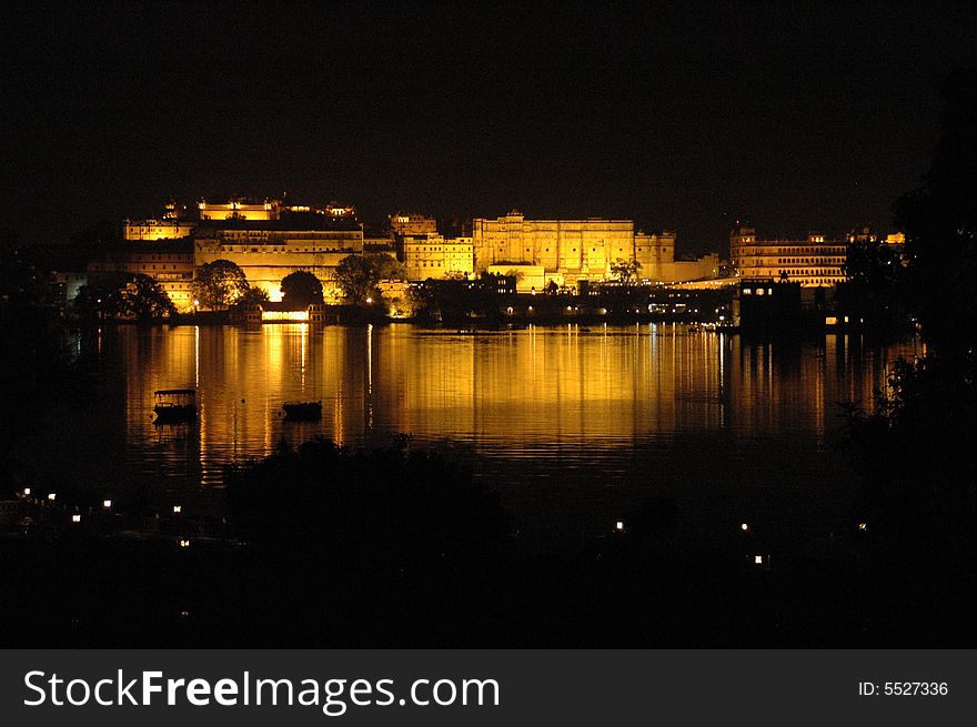 Picture of a reflection of lighted building on a lake at night. Picture of a reflection of lighted building on a lake at night