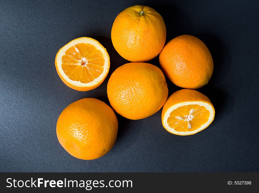 Orange fruits on the black background. Orange fruits on the black background