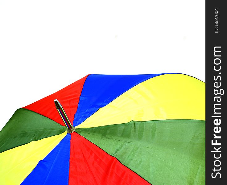 Detail of the top of a colorful umbrella on white