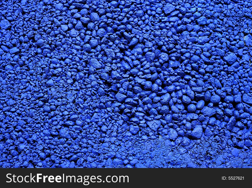Stones painted in blue color as textured background. Stones painted in blue color as textured background.