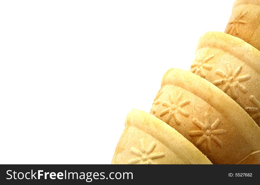 Detail on four ice cream cones on a white background