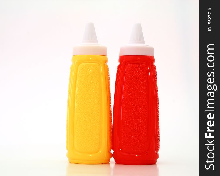 Yellow and red bottle on a white surface. Yellow and red bottle on a white surface