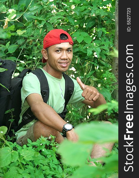 Hiking backpacker in the forest
