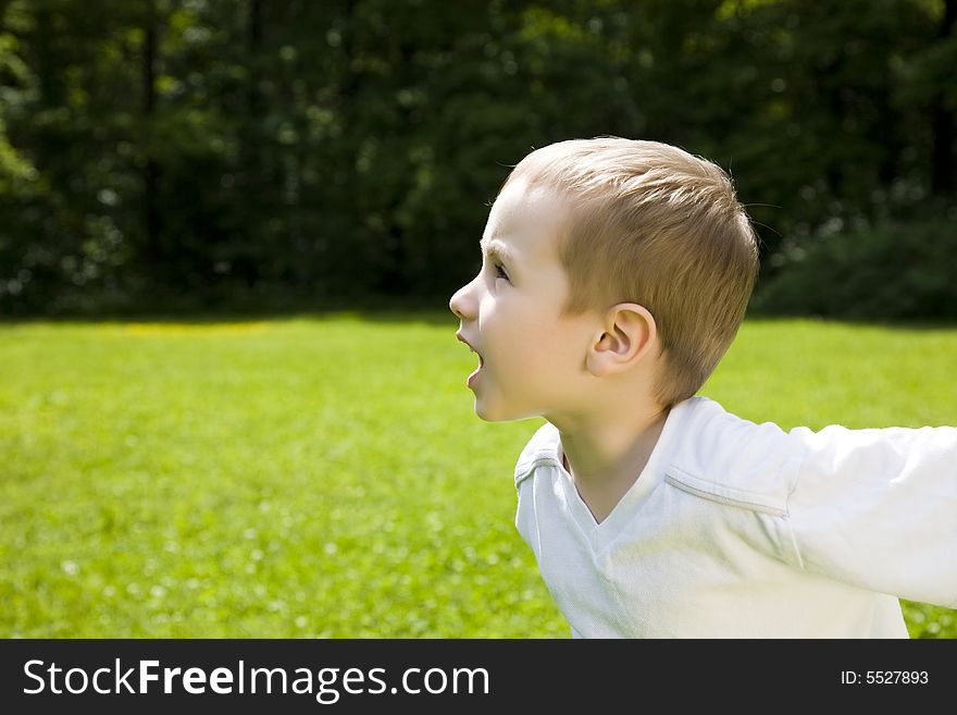 Running Boy Outdoors. Happy Childhood. Running Boy Outdoors. Happy Childhood.