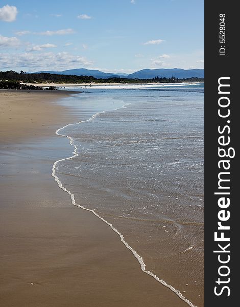 Beutifull coastline and wave hitting the beach. Byron Bay - Australia