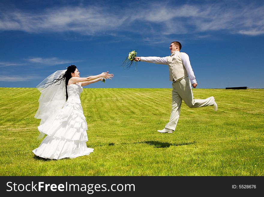 Groom gives bouquet to bride. Groom gives bouquet to bride