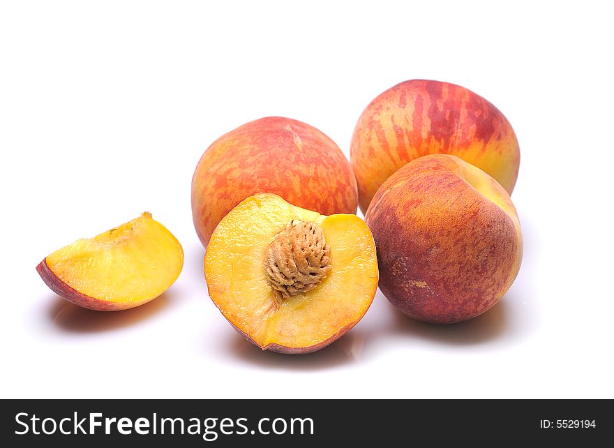 Fresh peachs on white background