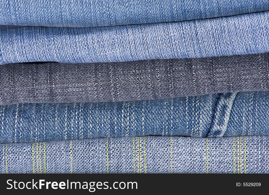 A pile of jeans in shades of blue