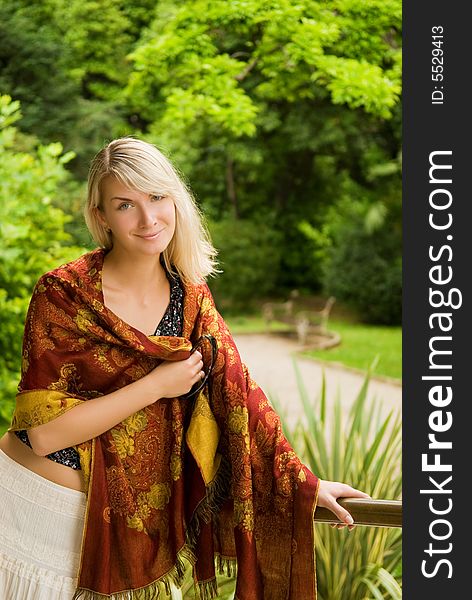 Beautiful young woman relaxing in a park