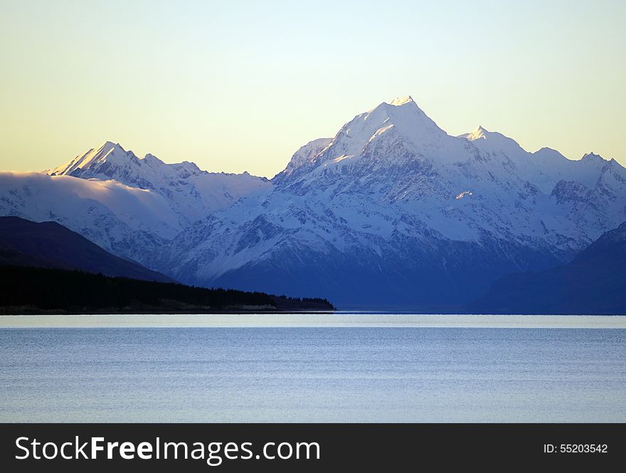 Snow covered Mount Cook peak and mountain range in southern New Zealand, Lake Pukaki. Snow covered Mount Cook peak and mountain range in southern New Zealand, Lake Pukaki