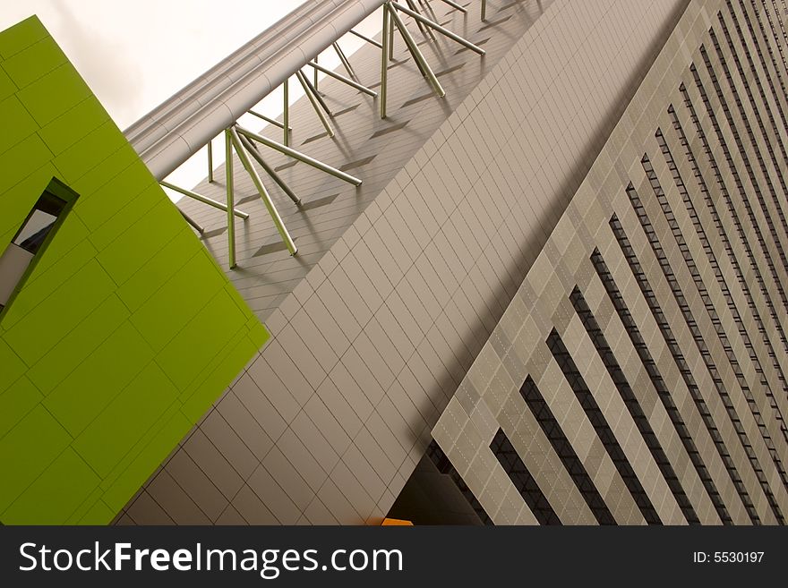 Contrast of modern architecture with its colours and shapes against a gray sky