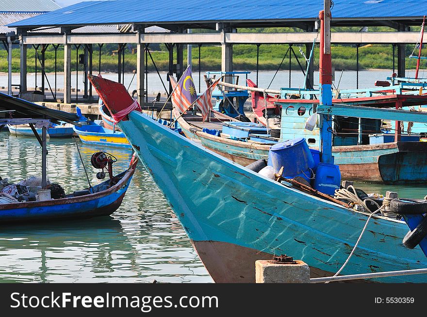 Fishing boat docked by the sea. Fishing boat docked by the sea