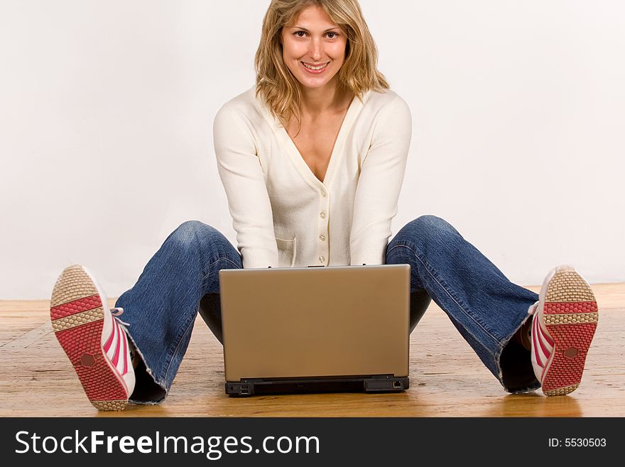 Beautiful young woman with laptop computer