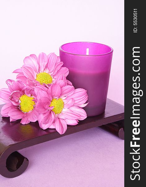 Calm color of candle and bunch of flowers. Calm color of candle and bunch of flowers
