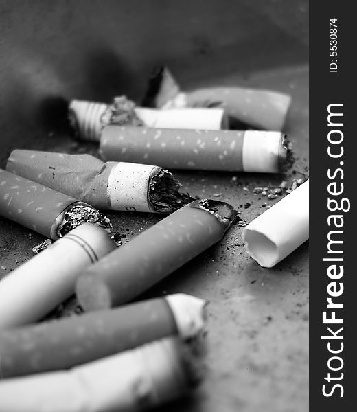 Cigarette Butts In Ashtray