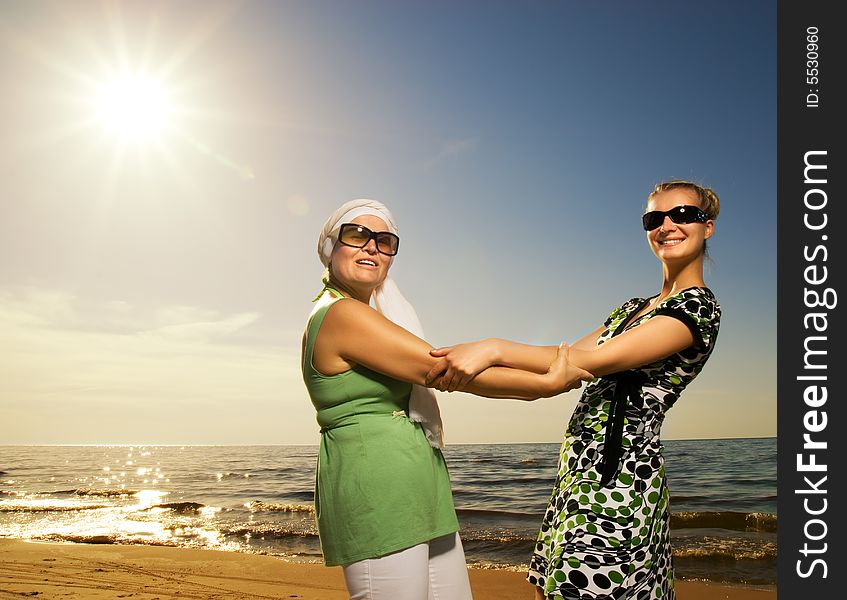 Women sitting on the beach