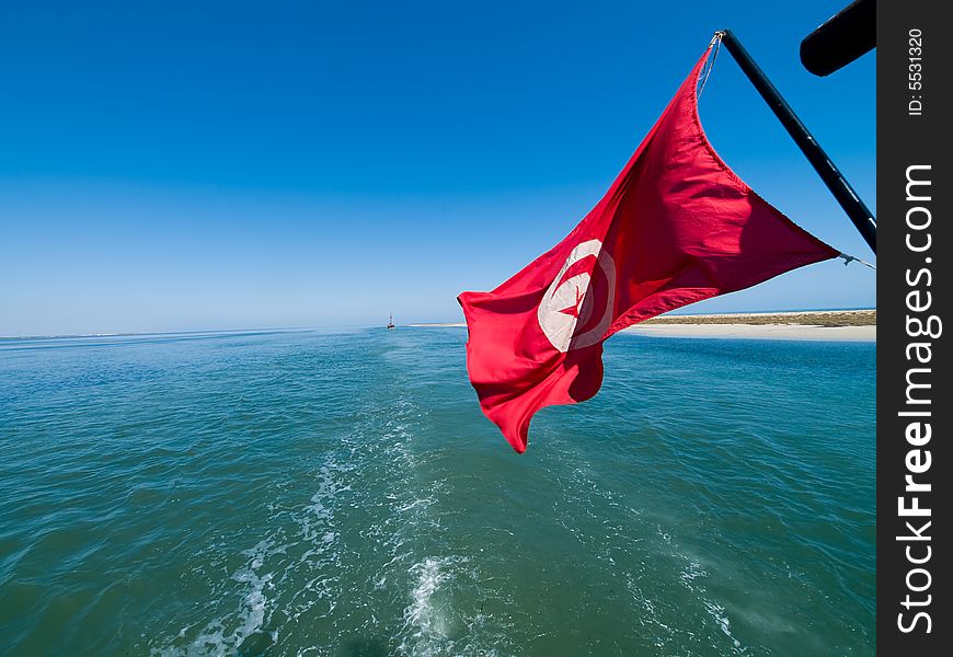 Tunisian flag waving on the ship. Tunisian flag waving on the ship