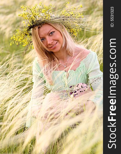 Sexy caucasian girl with flower garland