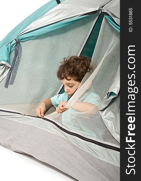 Young boy in a tent isolated on white