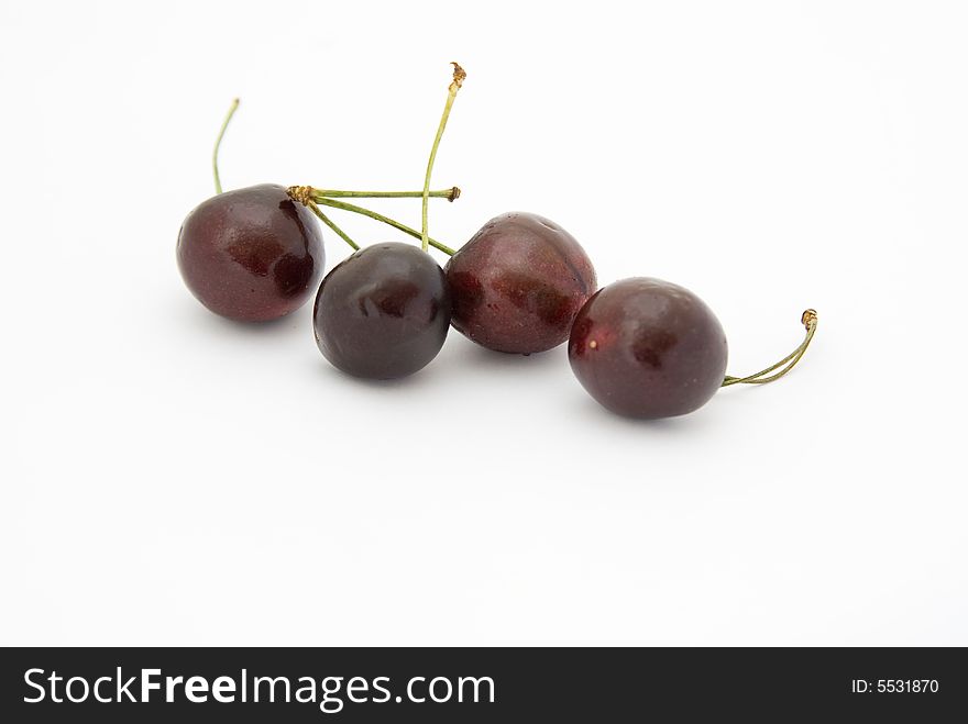 Four Big mature Cherry on white background. Four Big mature Cherry on white background