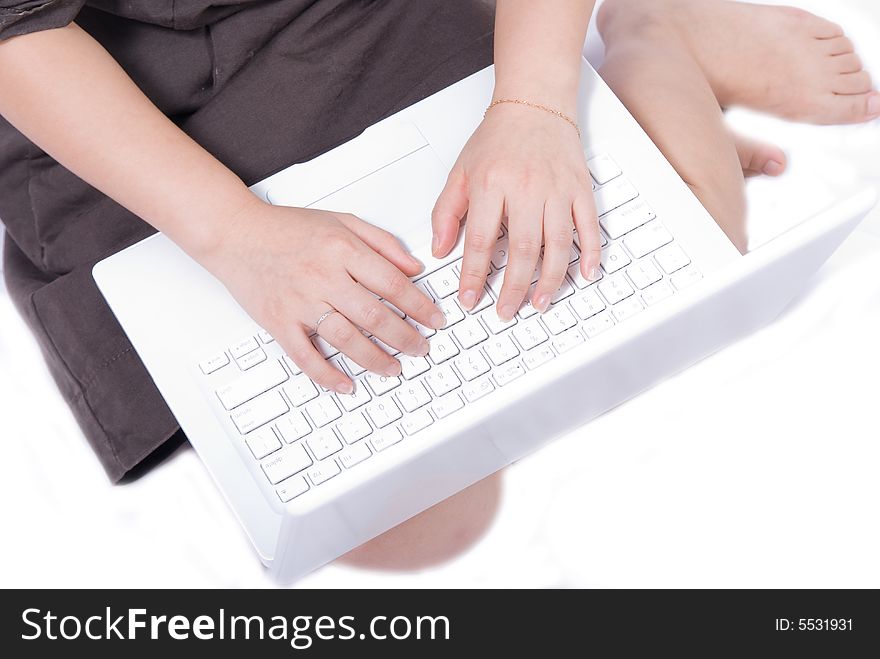 This photo featuring the perfect hands typing on a pure white notebook keyboard. This photo featuring the perfect hands typing on a pure white notebook keyboard