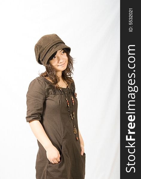 A cute asian girl wears a brown hat which fit her face and hair very well!. A cute asian girl wears a brown hat which fit her face and hair very well!