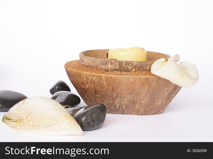 Coconut lit candle with spa items isolated. Coconut lit candle with spa items isolated