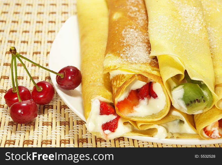 Pancakes filled with whipped cream cheese and berries. Pancakes filled with whipped cream cheese and berries