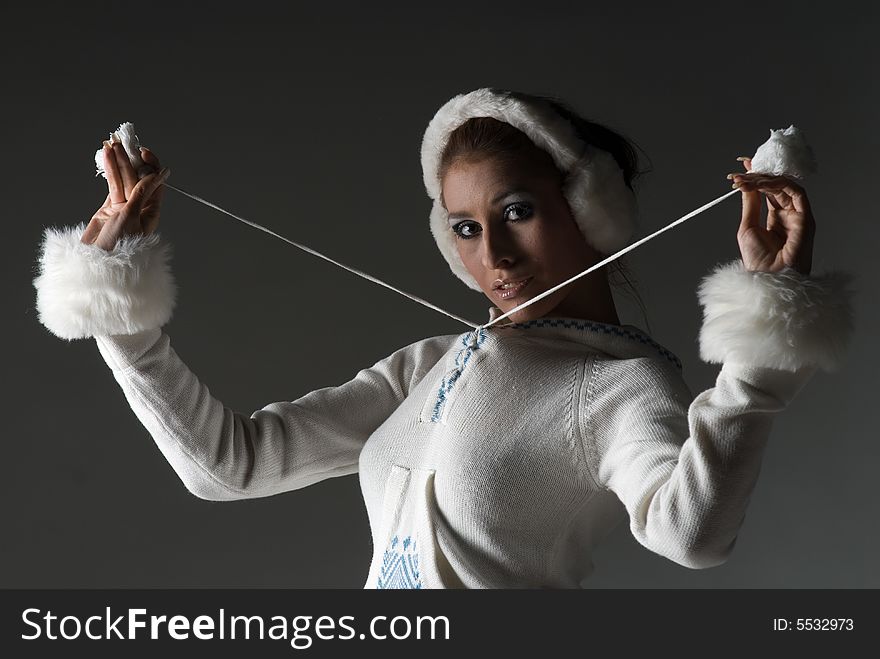 Beauty woman in white playing with hat. Beauty woman in white playing with hat