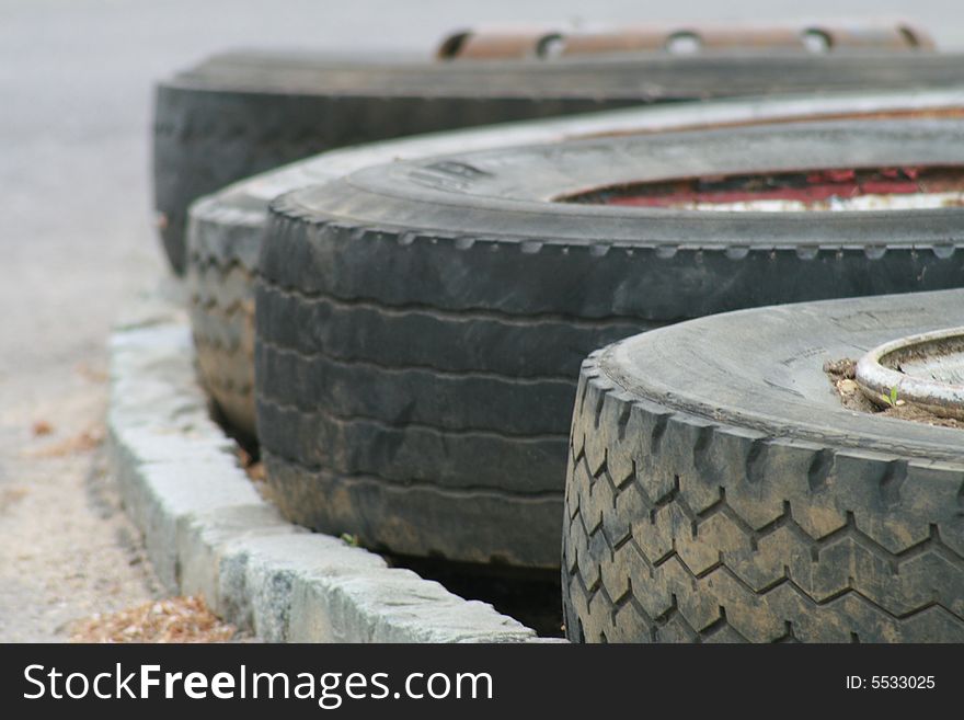 Big tyres lined together with big wheels. Big tyres lined together with big wheels