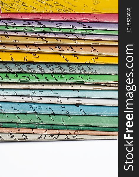 Stack of colorful books - white background