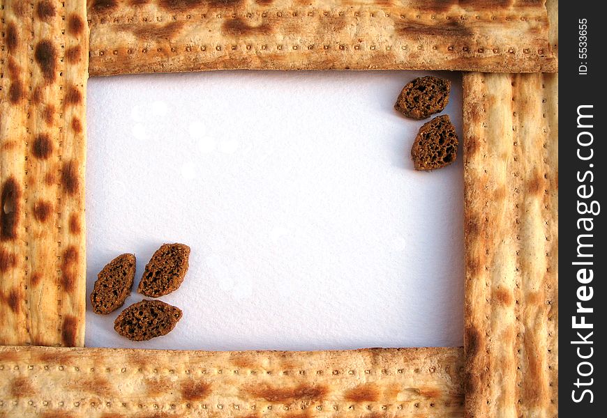 A frame of matzo with crackers on the light background. Macro