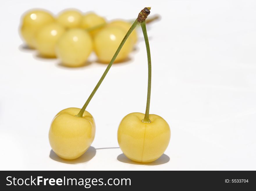 Pair to ripe yellow sweet cherries