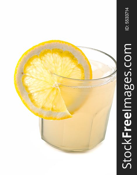 Glass of apple juice with lemon slice