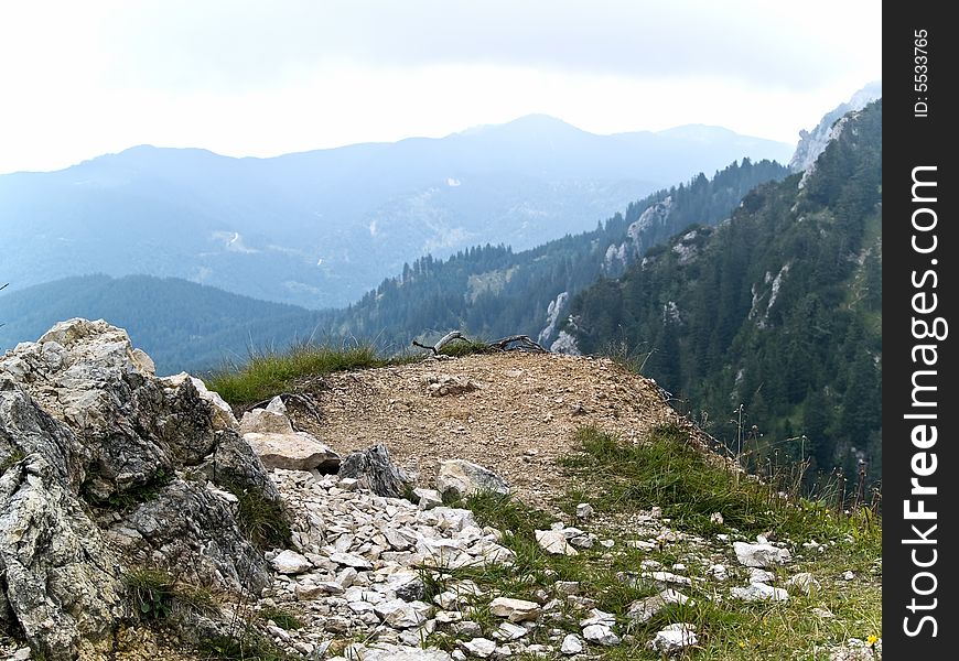 Alpine peak landscape rocky and grassy cliff. Alpine peak landscape rocky and grassy cliff