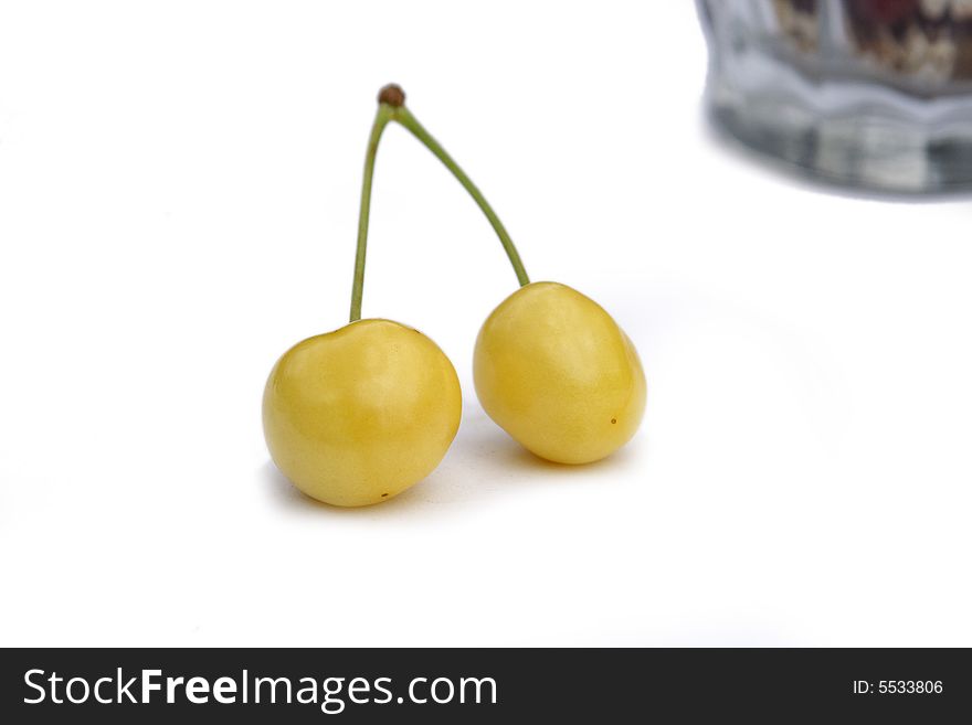 Pair to ripe yellow sweet cherries. Pair to ripe yellow sweet cherries