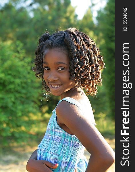 A beautiful african american child enjoying the outdoors. A beautiful african american child enjoying the outdoors