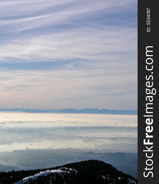 View from north shore mountains on the city of vancouver in the fog