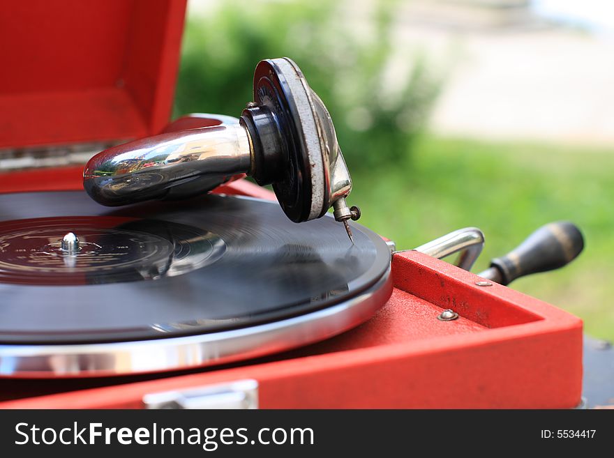 The antiquarian portable gramophone with disc, outdoor. The antiquarian portable gramophone with disc, outdoor
