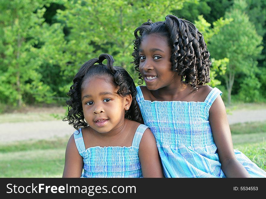 2 beautiful african american sisters enjoying the outdorrs. 2 beautiful african american sisters enjoying the outdorrs