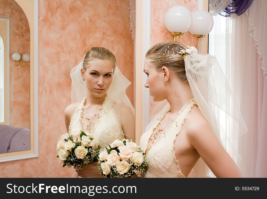 The bride near a mirror