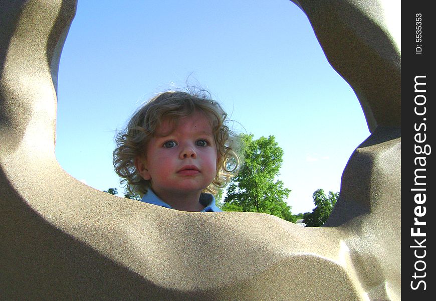 Shadow peeking through the rock climbing wall