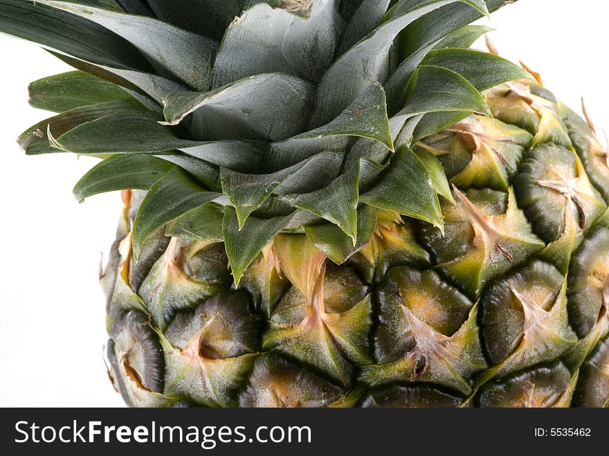 Part of a pineapple isolated on a white background. Part of a pineapple isolated on a white background.