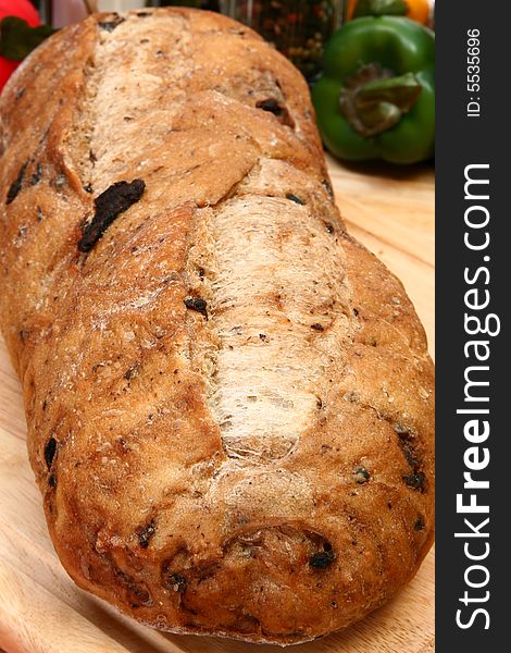 Whole olive bread loaf with parsley butter in kitchen or restaurant. Whole olive bread loaf with parsley butter in kitchen or restaurant.