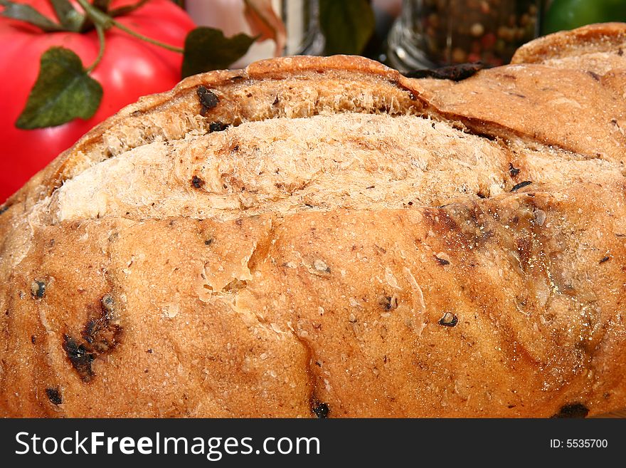 Whole olive bread loaf  in kitchen or restaurant. Whole olive bread loaf  in kitchen or restaurant.
