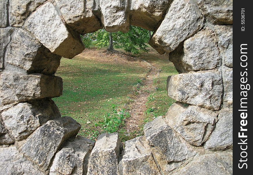 A view into a â€œfantasyâ€ land through a stone portal. Grant Park, Atlanta, GA.