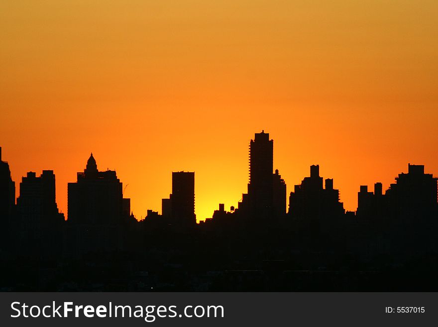 Silhouette of Manhattan highrises at sunset. Silhouette of Manhattan highrises at sunset.