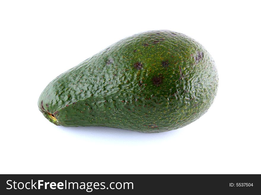 Intact avocado isolated on a white background.
