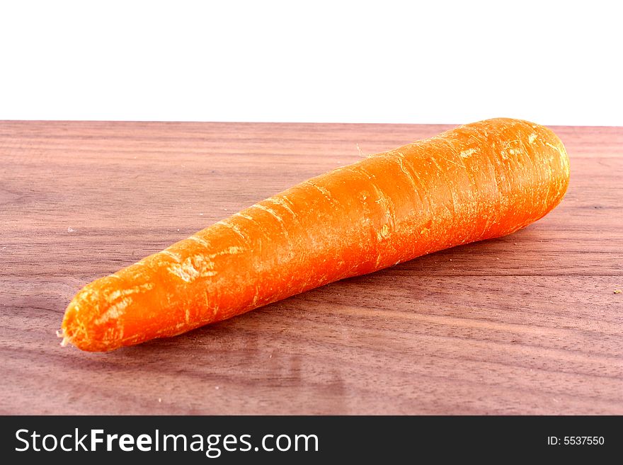 Carrot vegetable with slice on board